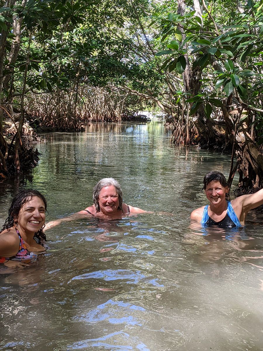Swimming from cenote near lagoon in Sisal Boat Tour